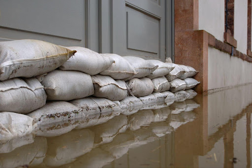 Installing flood-resistant barriers